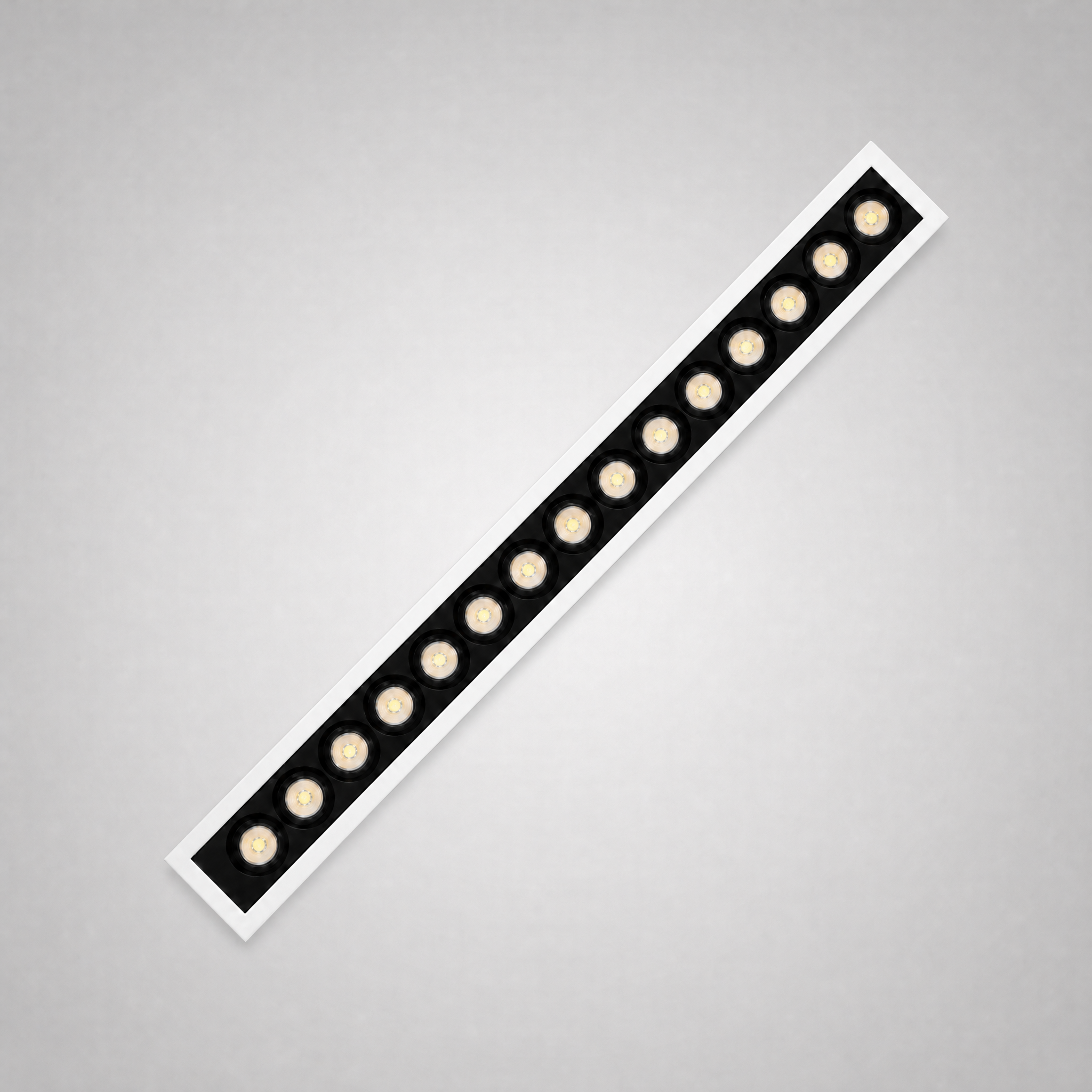 Architect Grille LED downlight — fifteen-head long-length linear grille, diagonal architectural shot