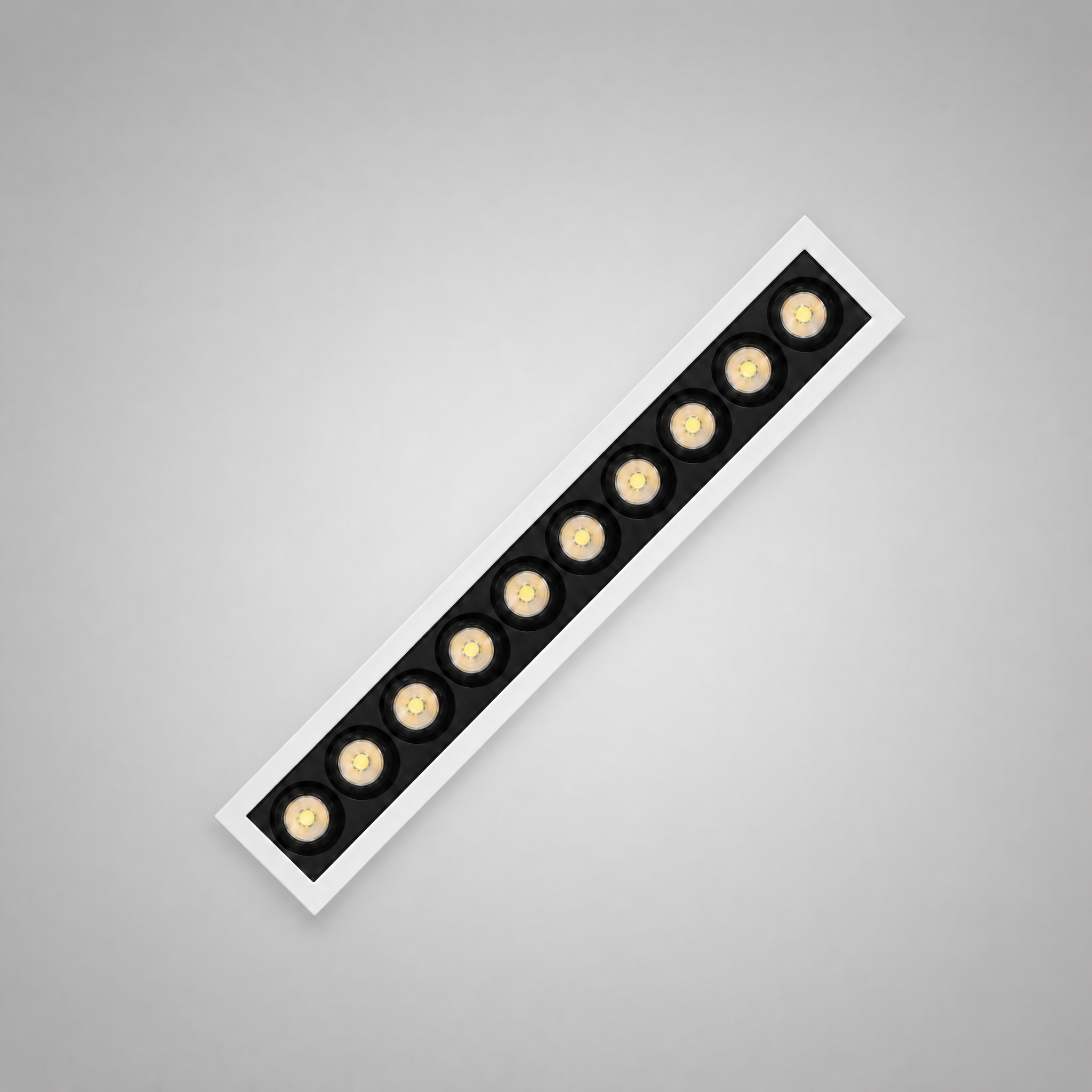Architect Grille LED downlight — ten-head medium-length linear grille, diagonal architectural shot