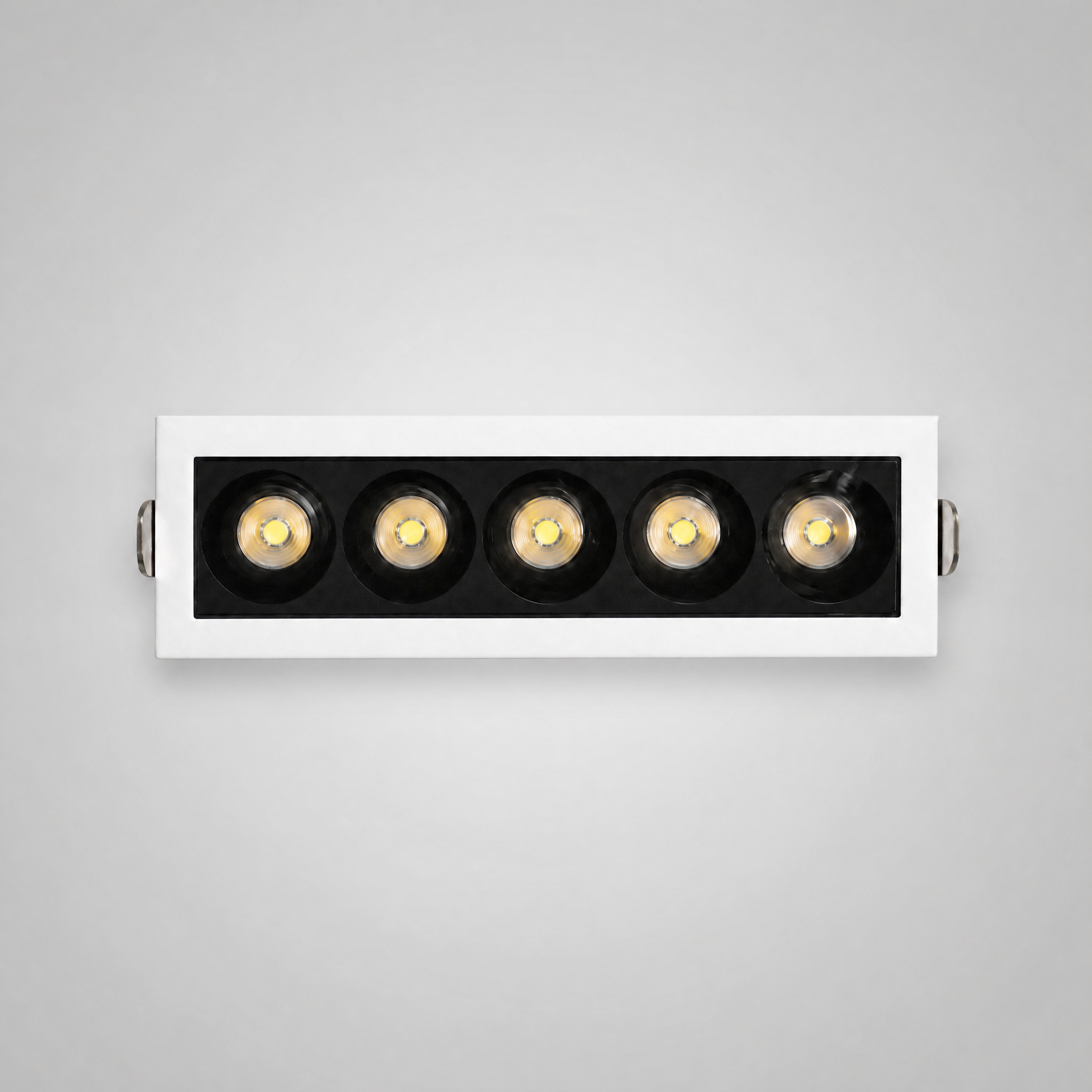 Architect Grille LED downlight — five-head linear grille with matte white frame and spring clips