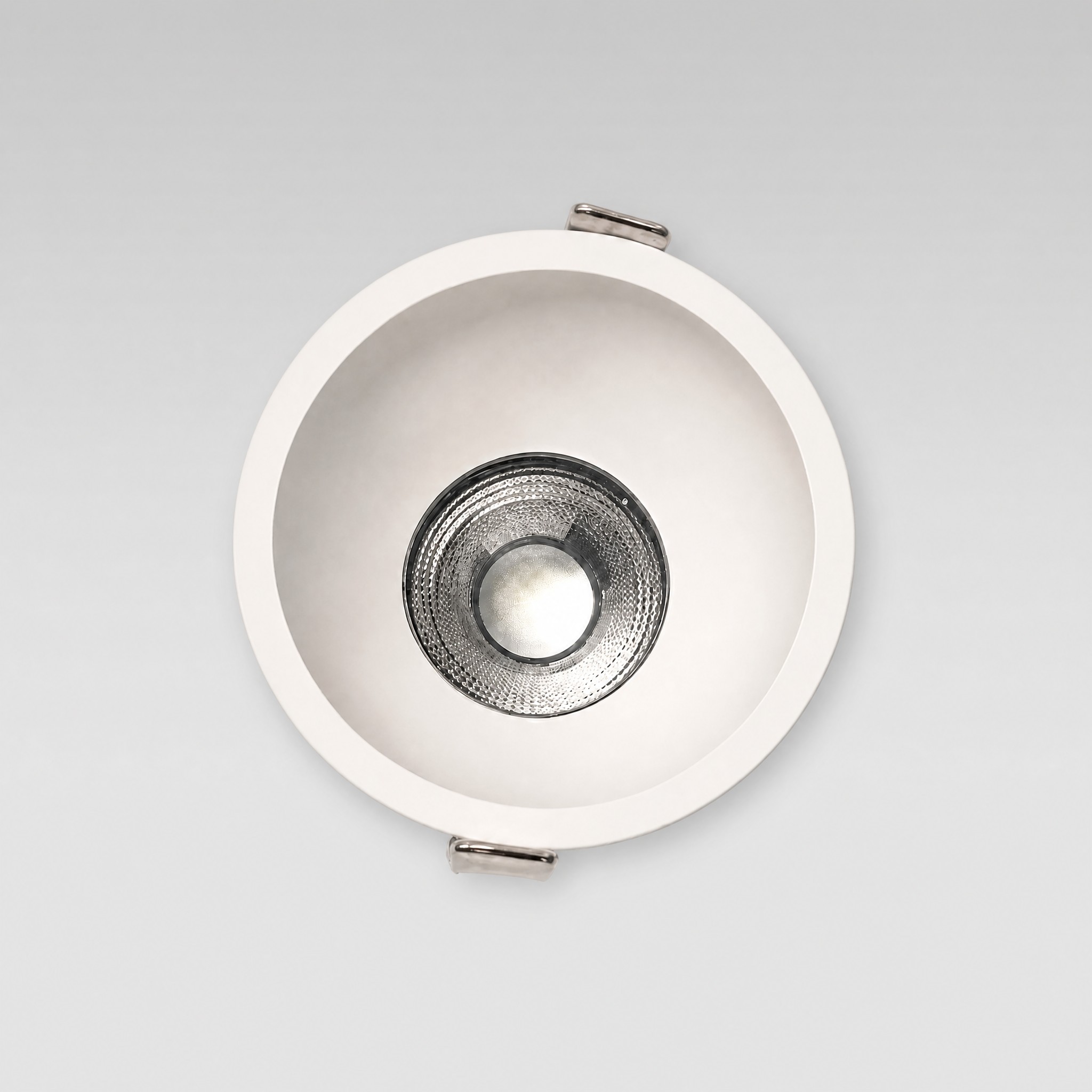 Coastal Tri-CCT IP44 LED downlight — front view showing the matte white trim and faceted silver reflector