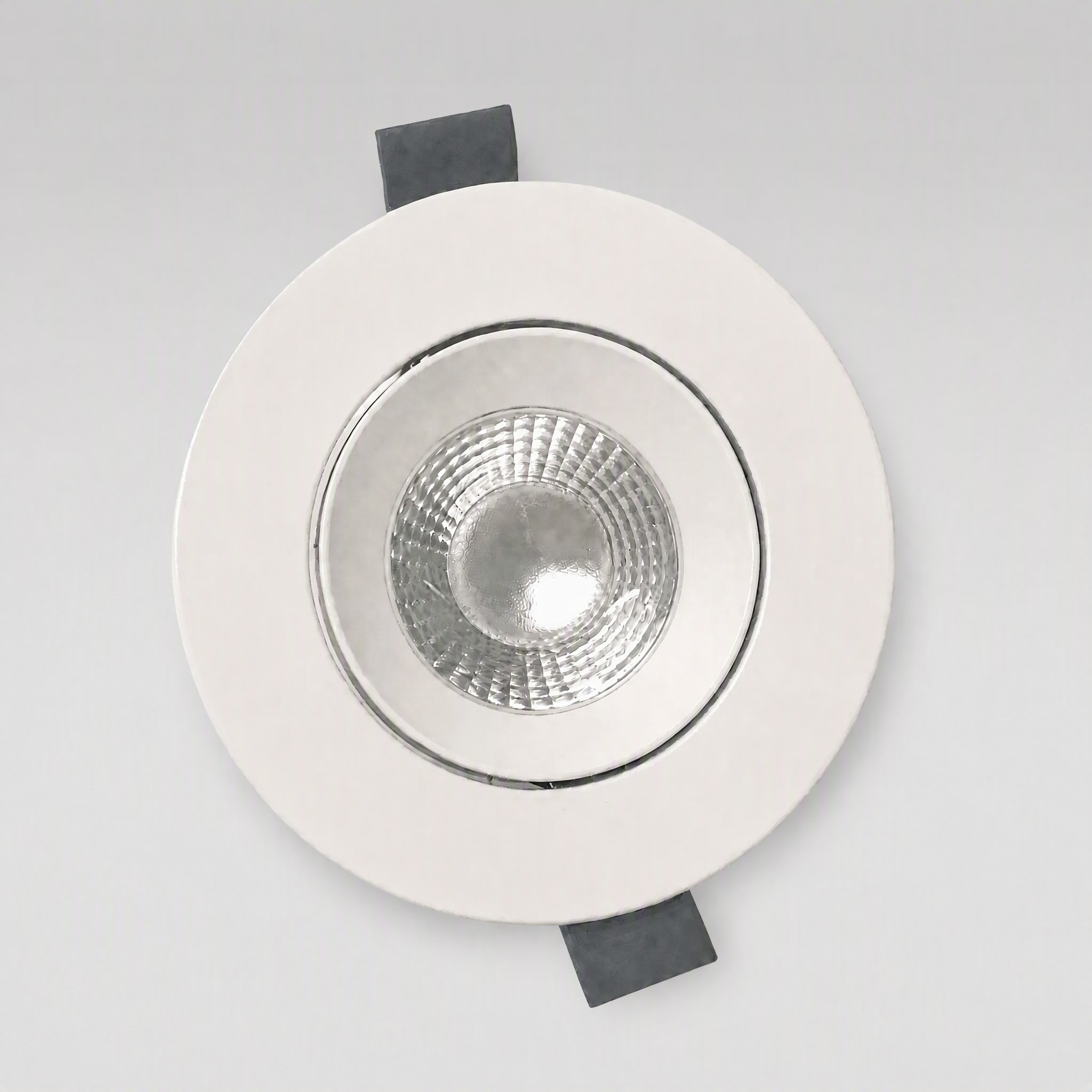 Essence Tri-CCT adjustable LED downlight — front view showing the matte white trim and adjustable gimbal reflector