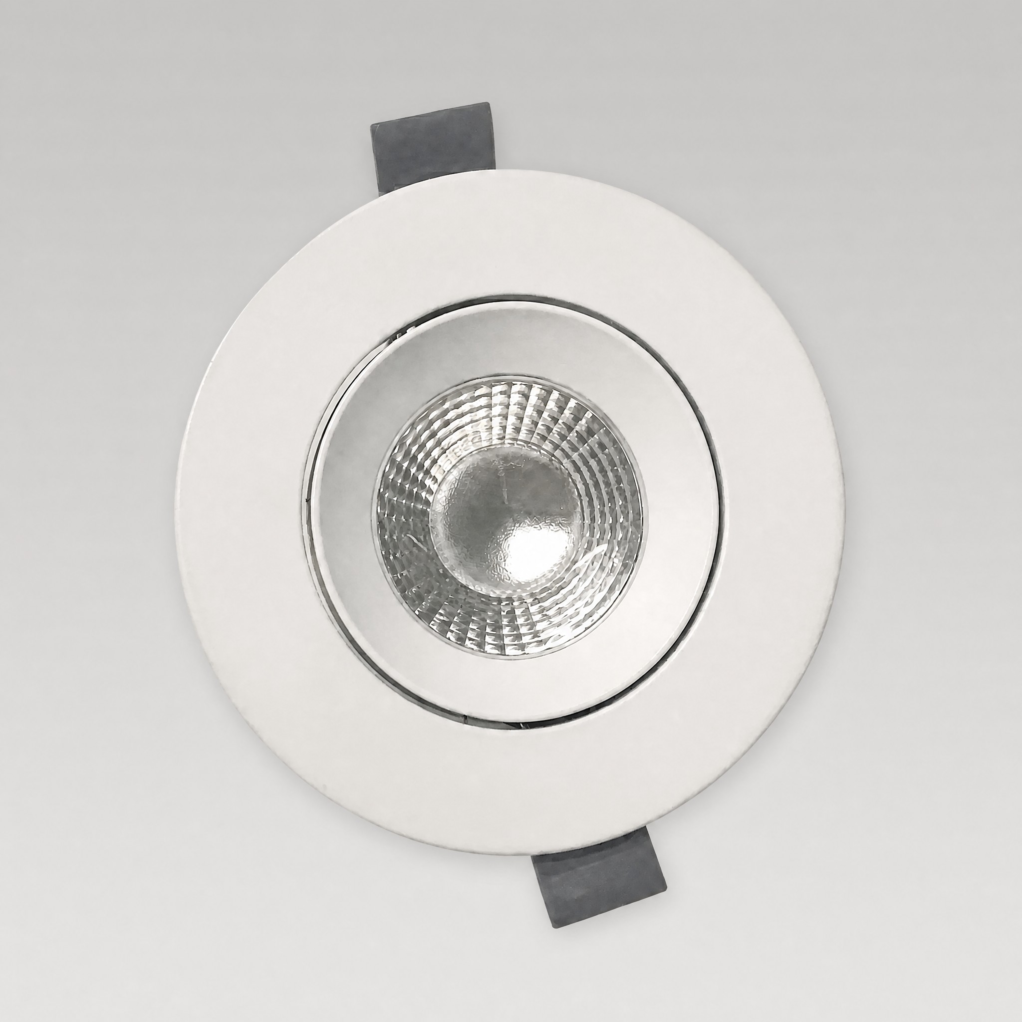 Essence adjustable LED downlight — front view showing the matte white trim and adjustable gimbal reflector