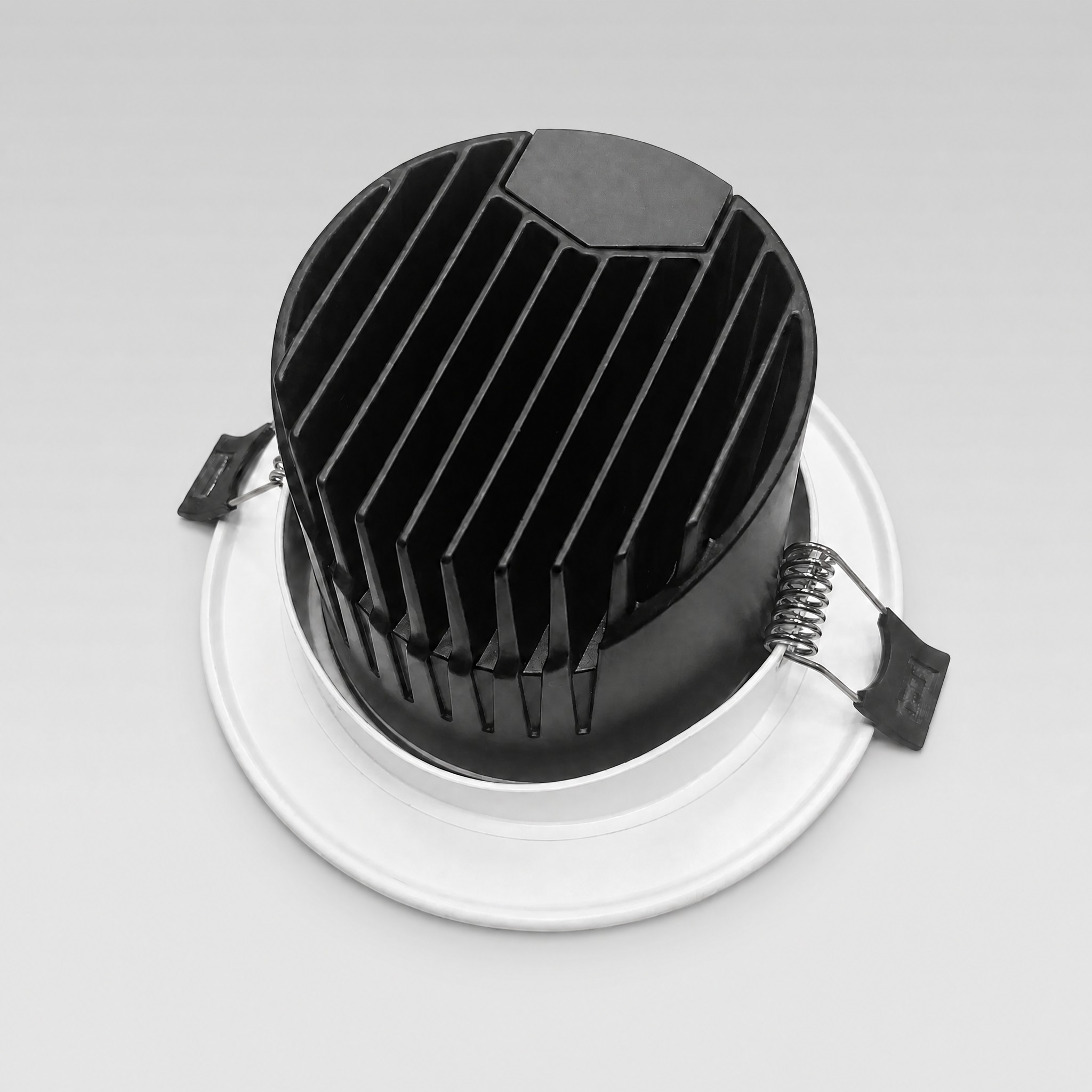 Essence adjustable LED downlight — rear view showing the heat-sink housing and spring mounting clips